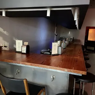 The entrance to the bar is the door at the end of the restaurant