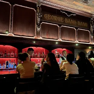 people sitting at a bar