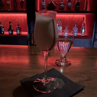 a drink in a glass on a bar