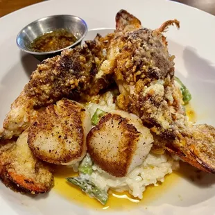Seafood trio of twin lobster tails, shrimp and scallops