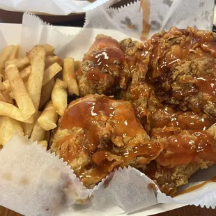 Half mix chicken with mild and hot sauce on it