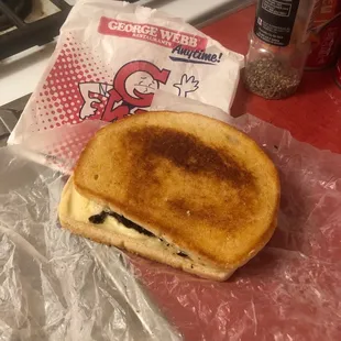 a grilled cheese sandwich on a plastic wrapper