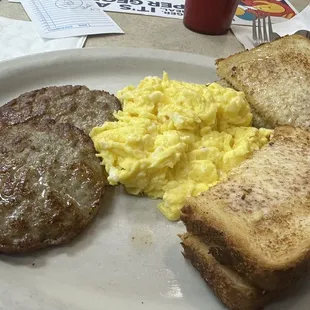 Three eggs, sausage and toast