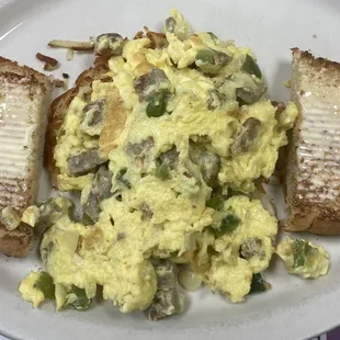 a plate of scrambled eggs and toast