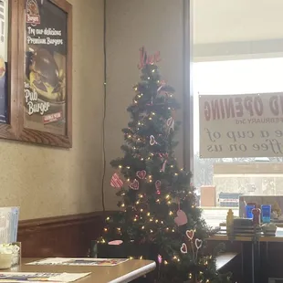 a christmas tree in a coffee shop