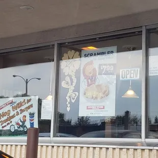 a car parked in front of a restaurant