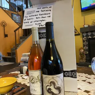 two bottles of wine on a table