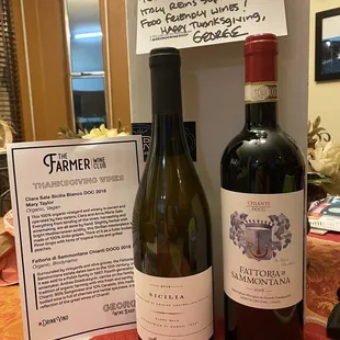 two bottles of wine on a table