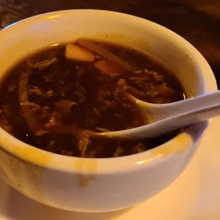 a bowl of soup with a spoon