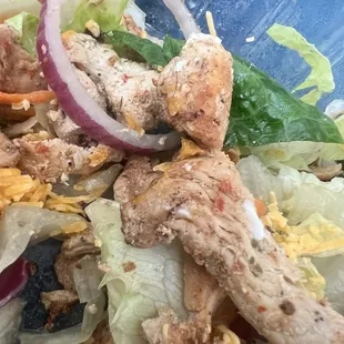 Hair wrapped around a piece of chicken in my salad