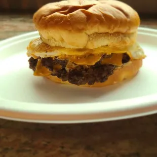 Breakfast Burger Cheddar cheese, bacon, and fried egg.