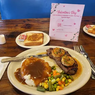 a plate of meat, mashed potatoes and vegetables