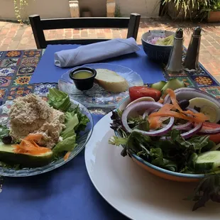 Garden salad, homemade Basalmic dressing, sourdough bread, a side of tuna salad and a house made pickle.