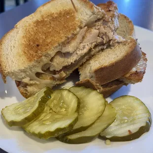 Delicious grilled chicken with Swiss and tomato on rye sandwich.