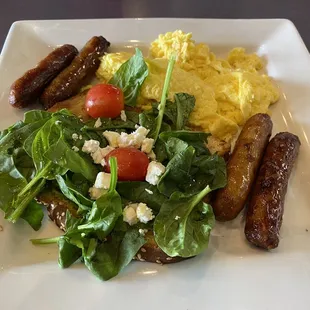 Avocado toast, with eggs and sausage