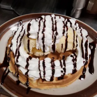 Pecan waffle with ice cream and Hershey&apos;s chocolate and whip cream . Nearly half the price of the competition