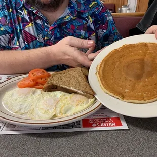 George&apos;s Breakfast...three eggs over easy, rye toast, sliced tomatoes in place of home fries, and one GIANT fluffy pancake.