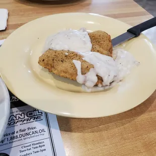 Country fried fork tender chopped steak and thick delicious gravy!