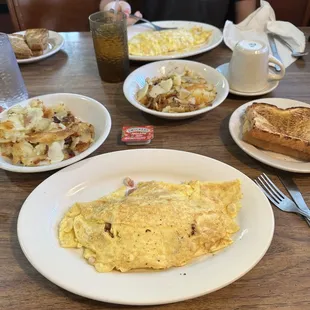 Hash omelet, bacon/cheese omelet, home fries, toast.