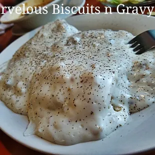 a plate of mashed potatoes and gravy