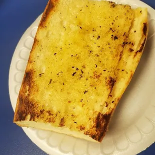 Side of garlic bread with the pasta dish