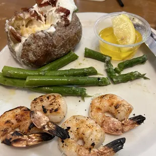 Shrimp dinner..!! The baked potato was filled with good stuff!!  5-6 shrimp on the plate!!