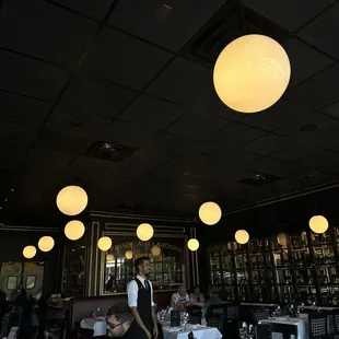 a waiter in a restaurant setting
