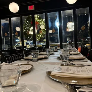 a view of a christmas tree through the windows