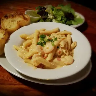 a plate of pasta and bread