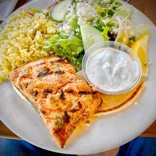 Grilled Salmon with rice and salad.