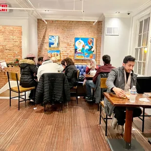  group of people sitting around a table