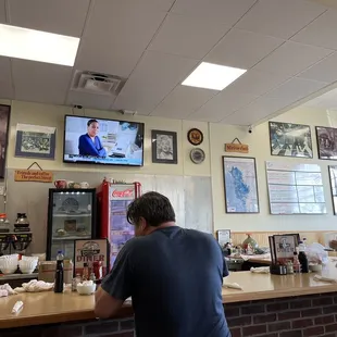 a man sitting at the counter