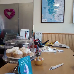 a table with pastries and a book