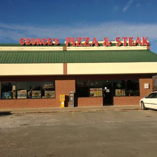 a car parked in front of the restaurant
