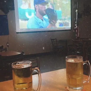two mugs of beer on a table