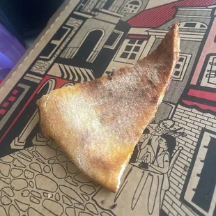 a slice of pizza in a box