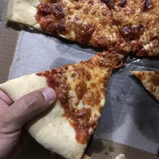 Pizza with Dough Crust ends as long as my husband&apos;s thumb