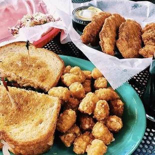 a plate of fried chicken and a sandwich