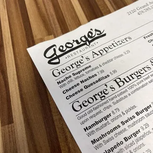 a menu on a wooden table