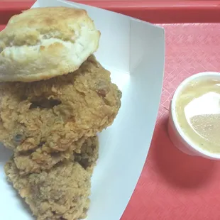 Two piece chicken plate w very small cup of potatoes n gravy