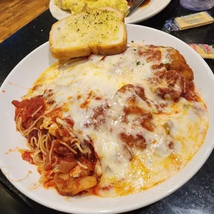 Delicious Chicken Parmesan with grilled shrimp and loads of cheese.