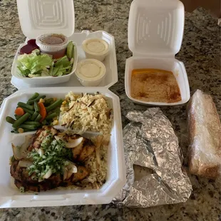 Chicken lunch plate comes with pilaf, veggies, bread and a side of soup or salad! Hummus and garlic sauce are THE BEST.