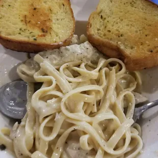 a plate of pasta and bread