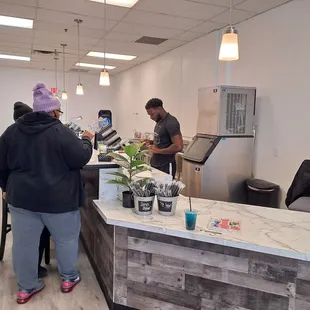 two people standing at a counter