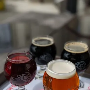 a variety of beers on a tray