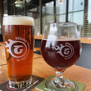 two glasses of beer on a table