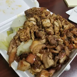 Half bourbon chicken, half Cajun chicken over rice and vegetables (mostly cabbage)