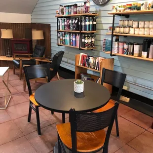 a table and chairs in a coffee shop