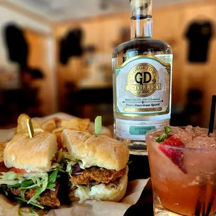 two sandwiches and a drink on a table