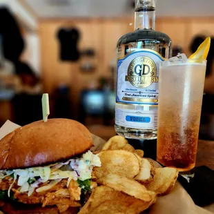 a burger and chips on a table